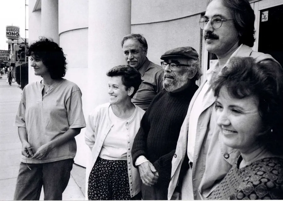 A group of UIMA community members standing together outside on a Chicago street